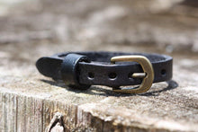 Load image into Gallery viewer, This adjustable leather bracelet makes a perfect gift for a child or teanager.  It can be worn as small as 5 3/4&quot; or be adjusted to a wrist bracelet of 7 1/4&quot;.  