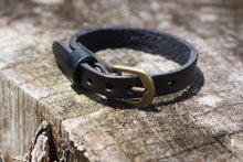 Load image into Gallery viewer, This adjustable leather bracelet makes a perfect gift for a child or teanager.  It can be worn as small as 5 3/4&quot; or be adjusted to a wrist bracelet of 7 1/4&quot;.  